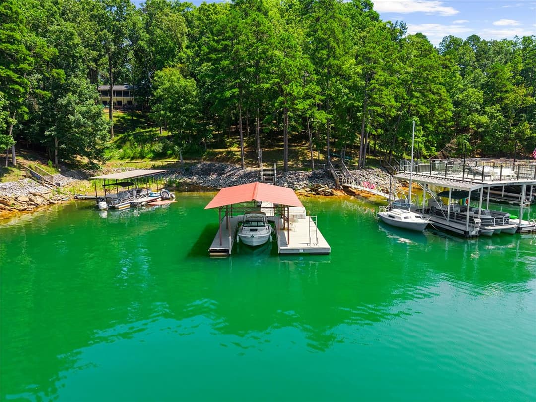 7865 Robin Rd — aerial view of home and wooded lot
