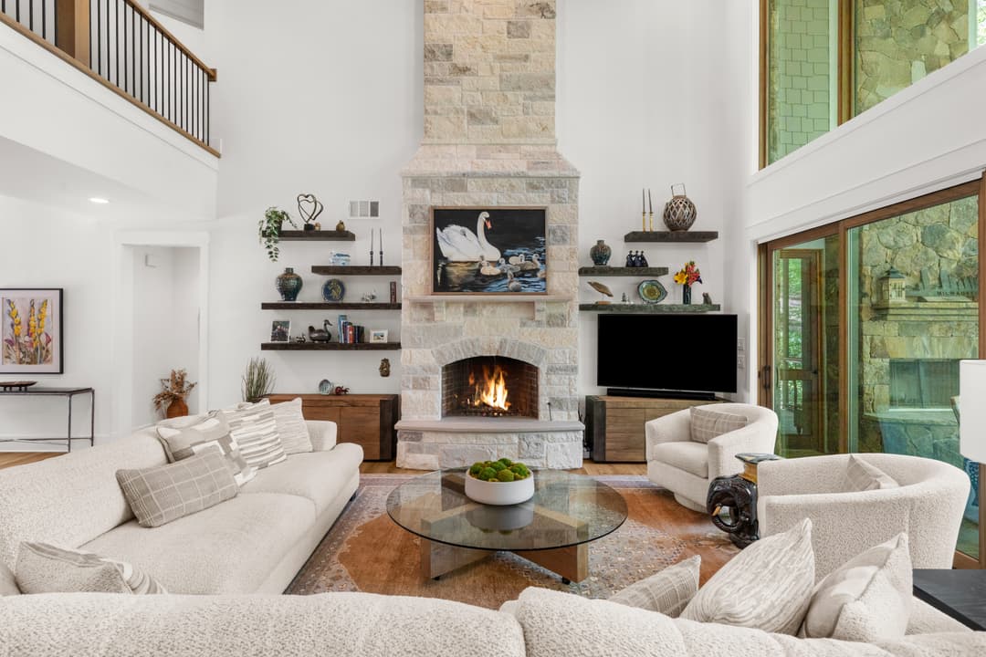 Main level living area with high ceilings and seamless indoor/outdoor flow