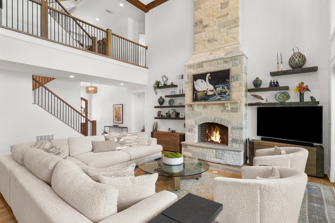 Family room with linen sectional, fireplace, and Lake Lanier view