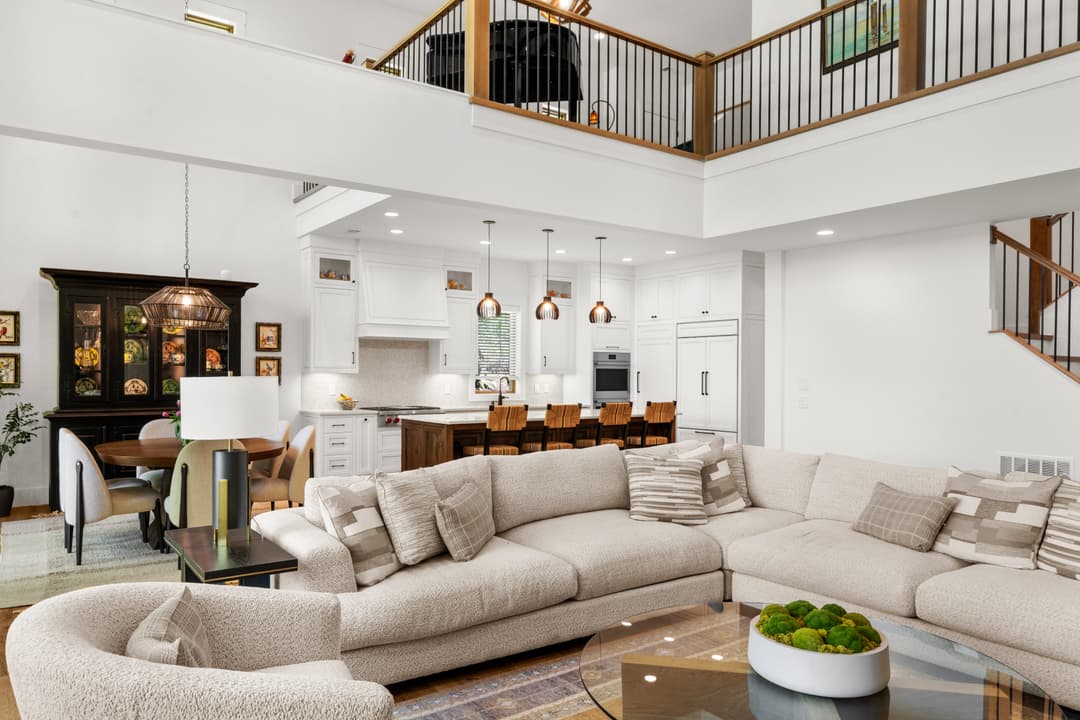 Bright open living room with hardwood floors and natural light