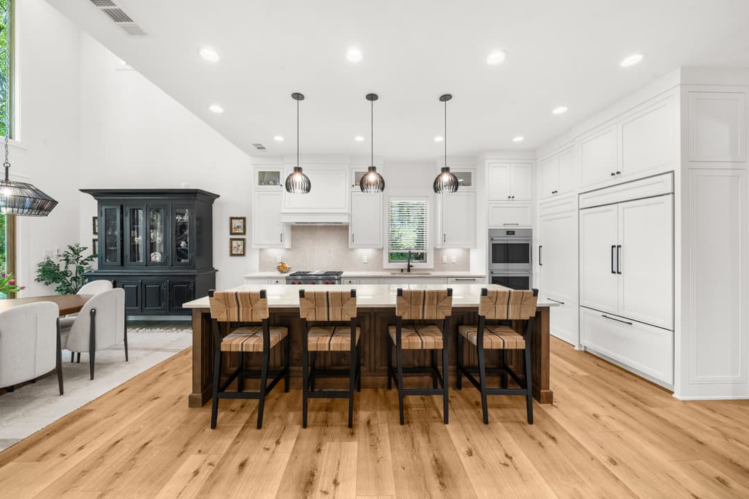 Dining room with statement chandelier and lake views