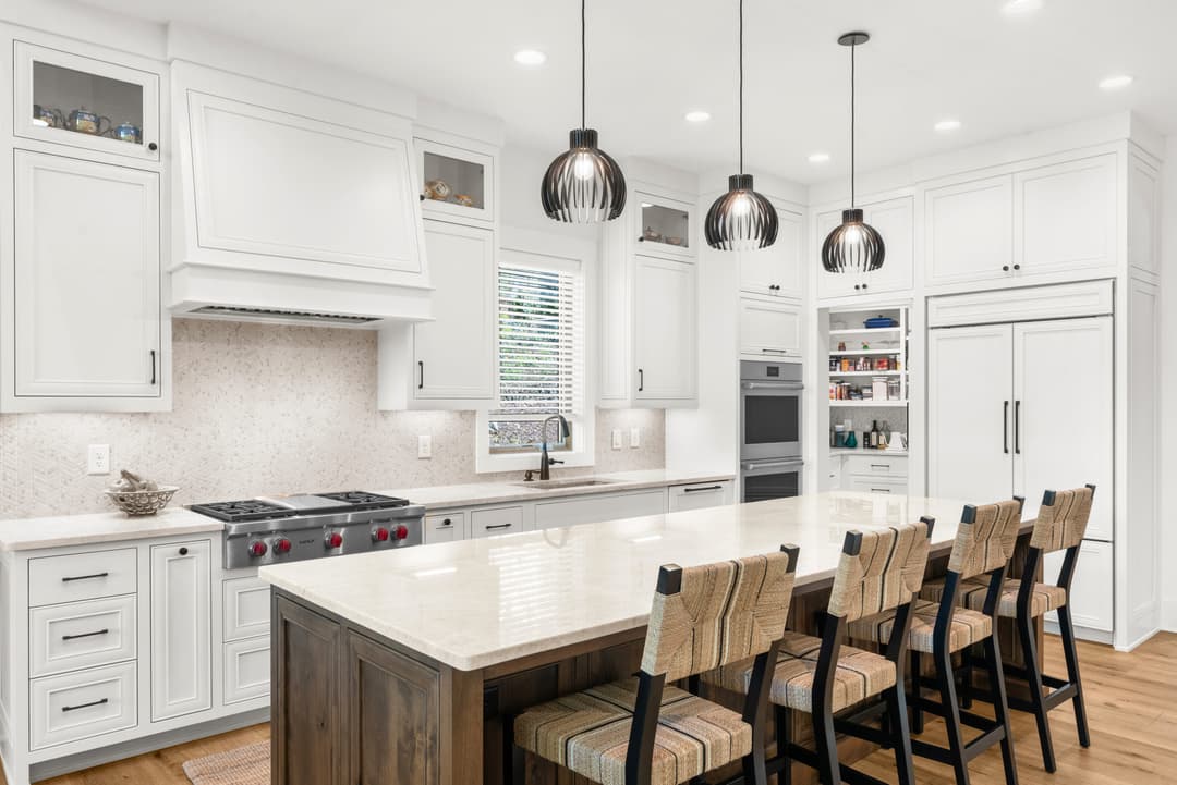 Chef-grade kitchen island with pendant lighting and bar seating