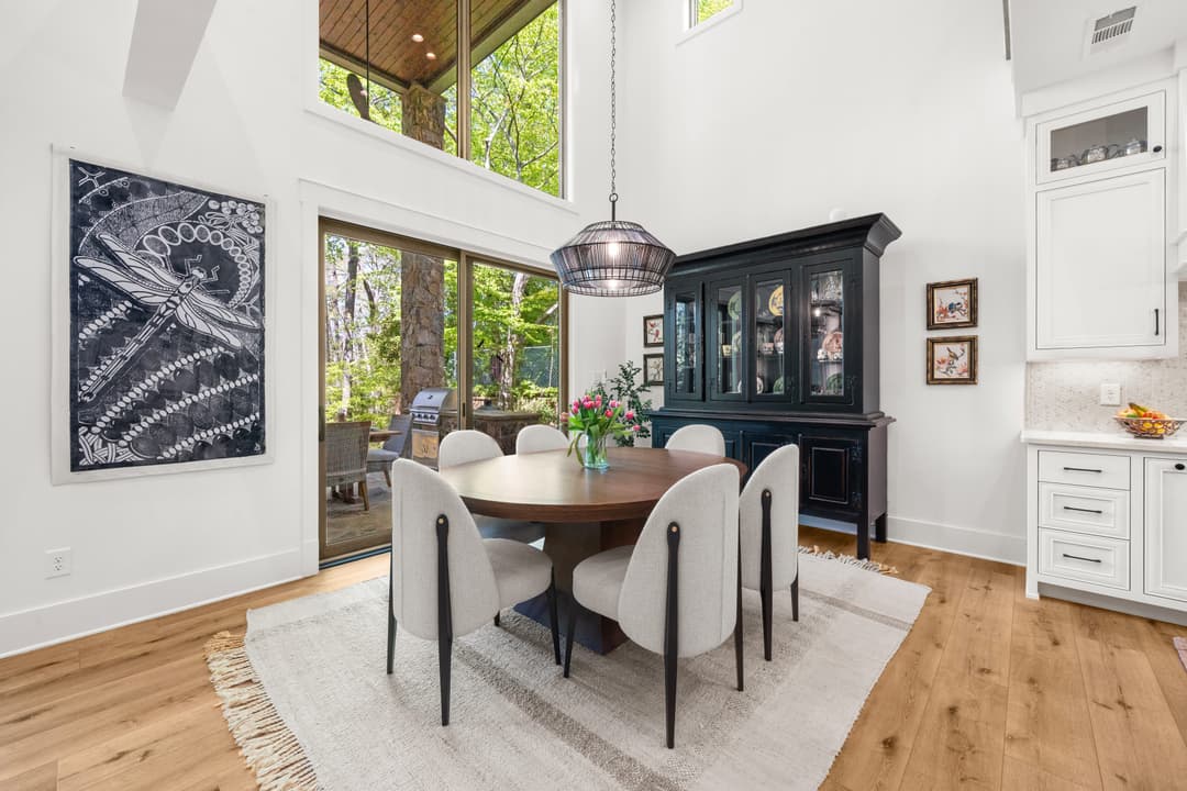 Kitchen overlooking the main living room and lake — open-concept gathering space