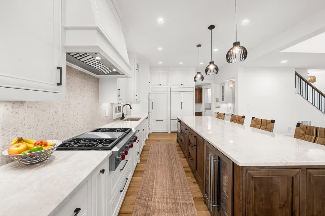 Range and hood detail in the chef-grade kitchen