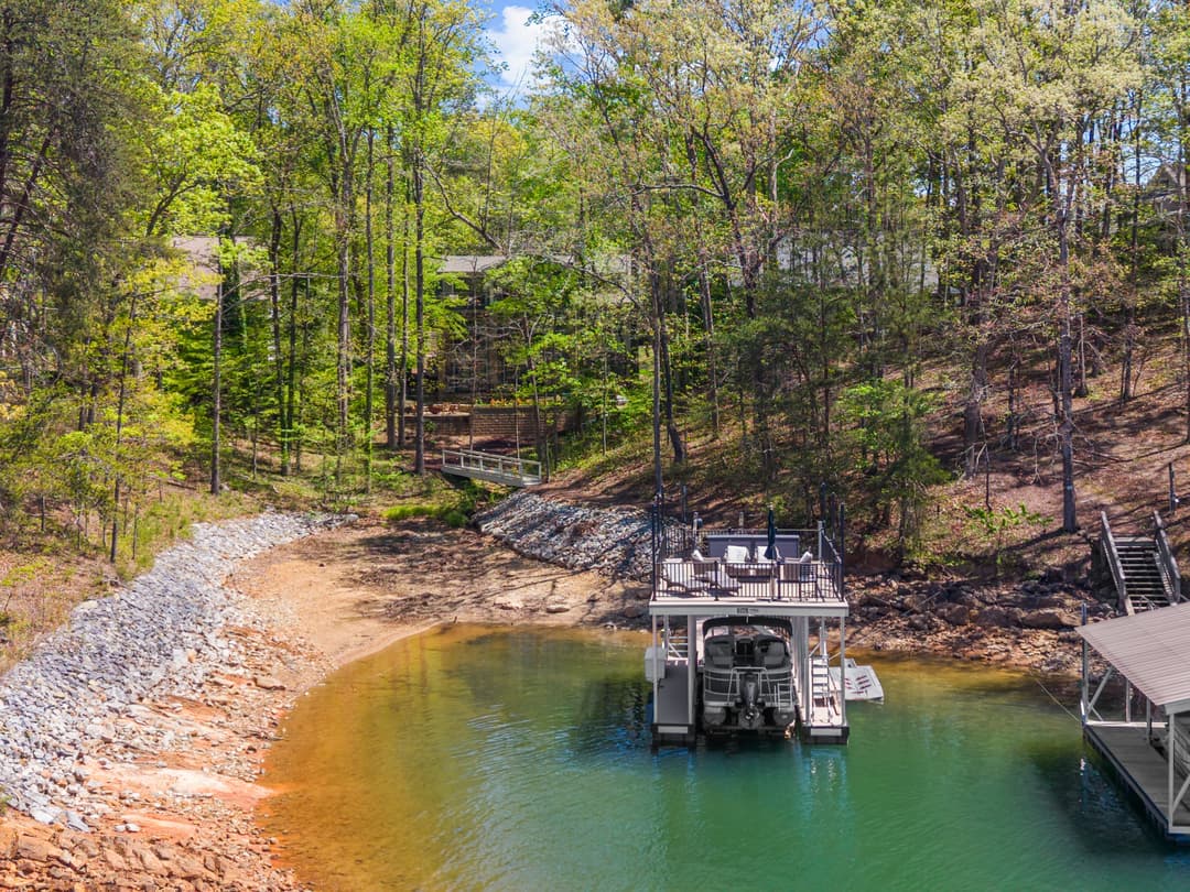 Aerial sweep across the cove from the dock toward open water