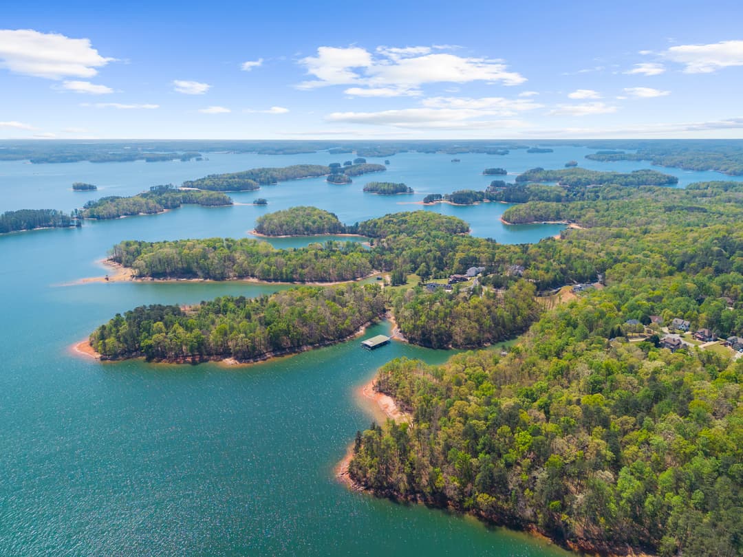 Aerial view of Lake Lanier with the home and surrounding shoreline
