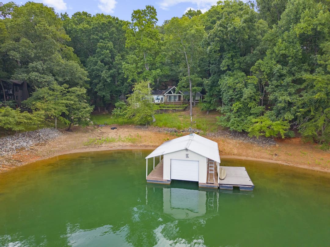 Aerial view of a private off-market lake home in Deer Creek Shores on Lake Lanier, Cumming GA