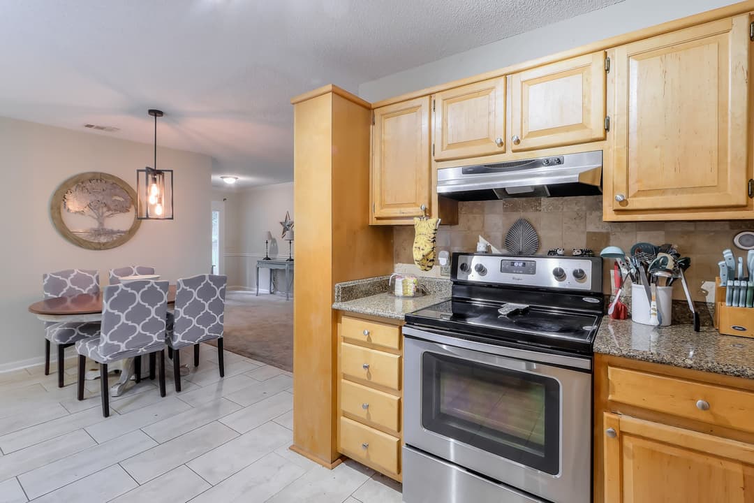 02b Kitchen Dining has updated lighting floors appliances and smooth ceilings 8493 Dawsonville Hwy 10 scaled at 8493 dawsonville highway