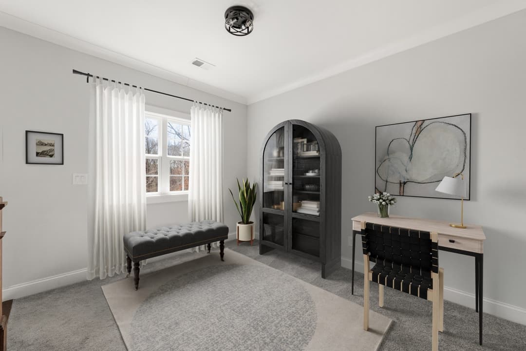 08. Primary bedroom sitting area has seasonal lake views virtually staged scaled at 6444 point twenty two