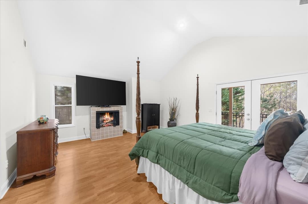 Upstairs second primary bedroom with private deck and balcony