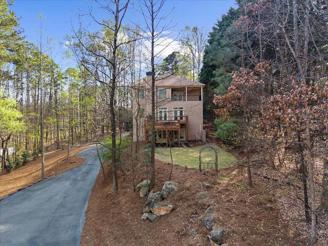 Paved and gravel driveway leading to the private dock