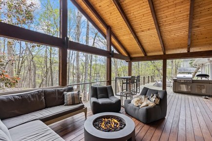 Rear deck of a waterfront home overlooking a dock in Lake Lanier, Hall County GA