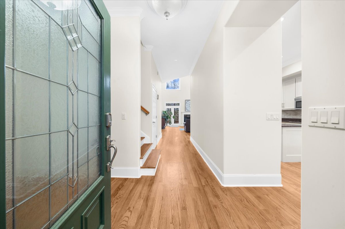 Welcoming entry with hardwood floors and natural light