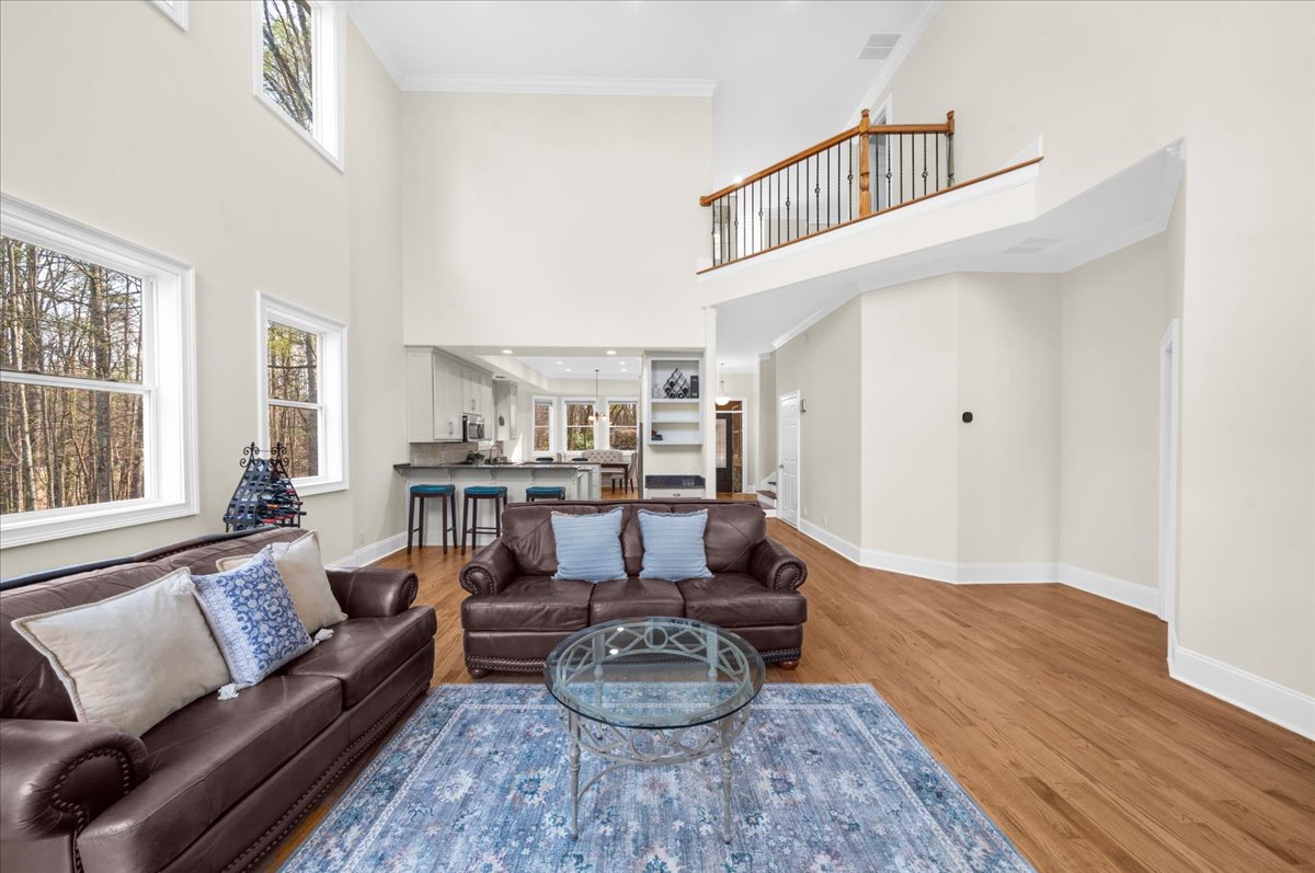 Family room with vaulted ceiling and lake views