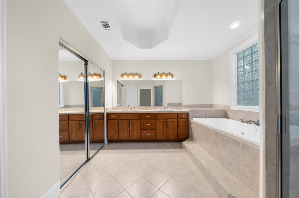 Lower level primary bathroom with dual vanity
